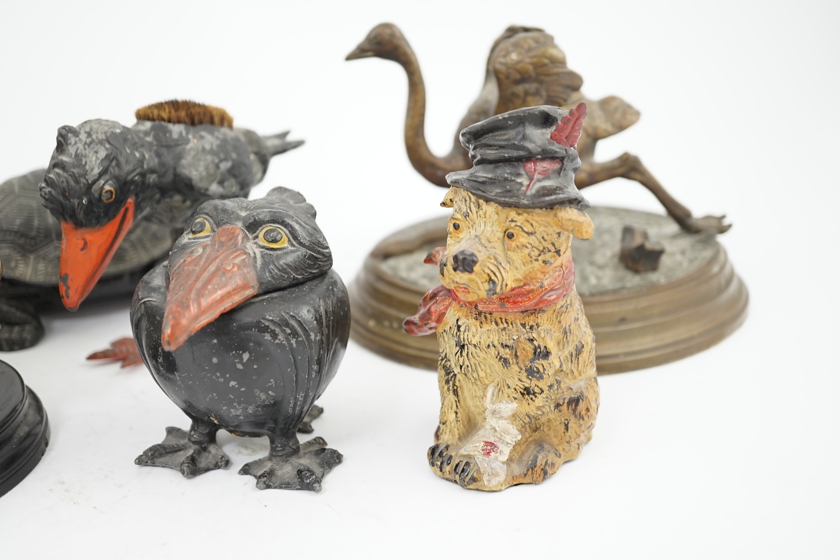 A collection of nine 19th and 20th century novelty animal bronze and metal ink wells, including a Martin Brothers-style ‘Wally’ inkwell. Condition - minor chips due to use and age